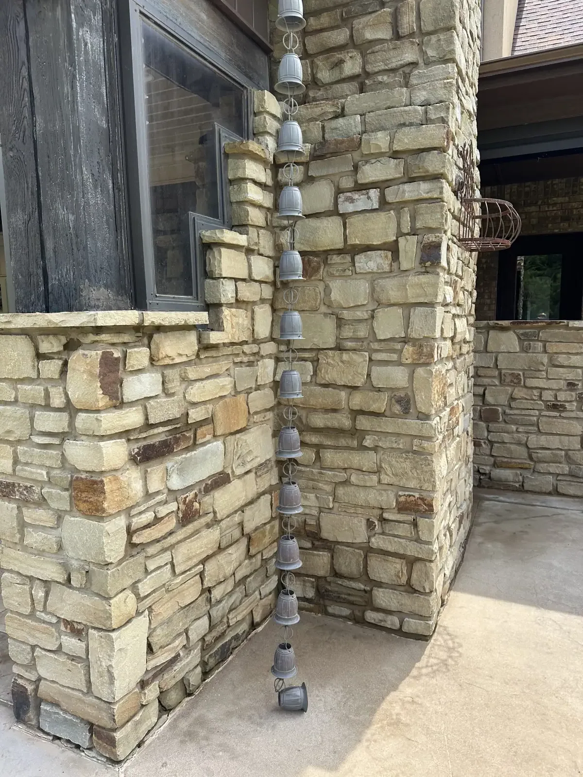 Stone exterior and rain chain after soft washing